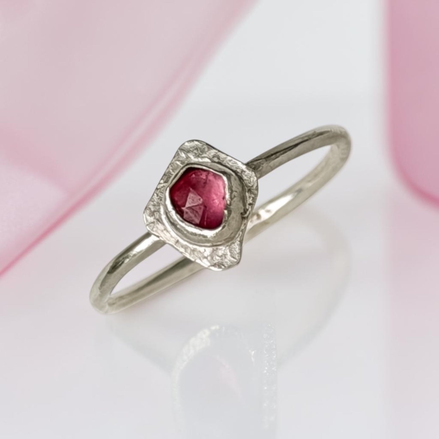 Sterling silver tourmaline ring by Aprilierre featuring a vibrant raspberry-colored gemstone, size 8.25.