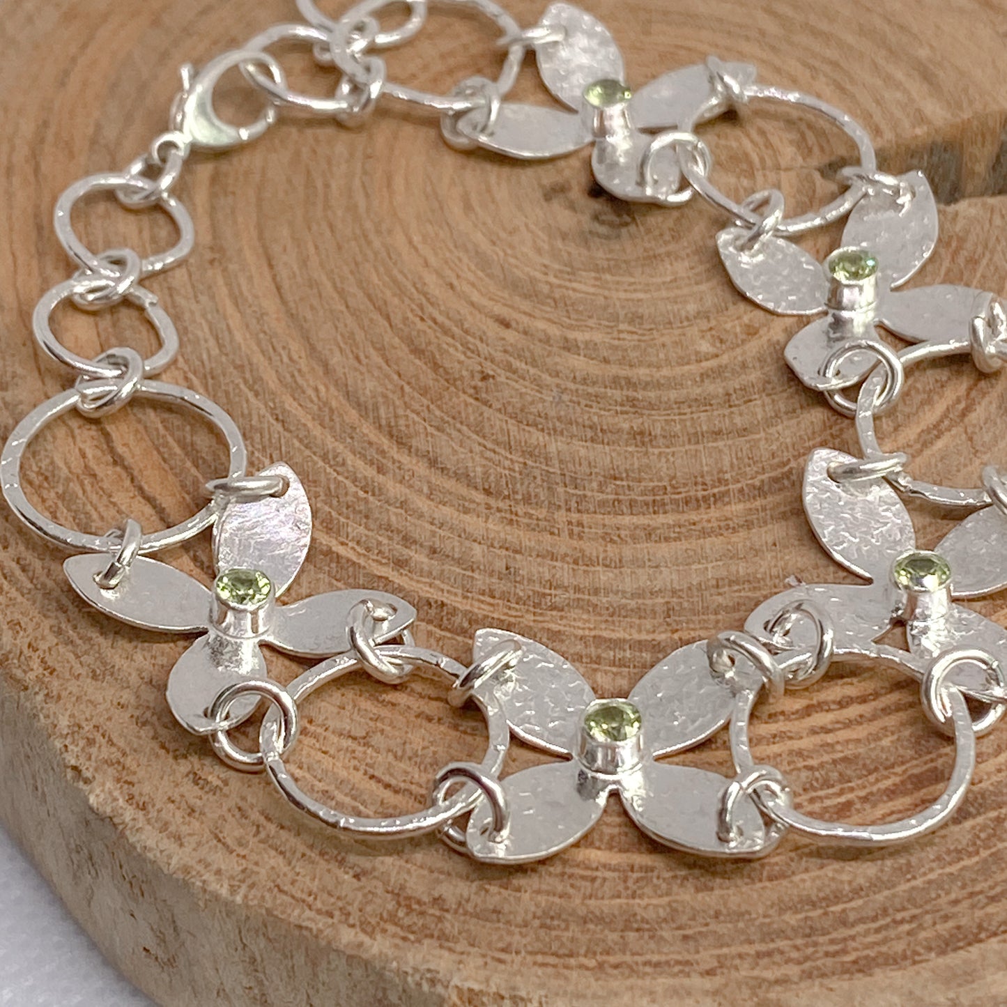 Sterling Silver Flower Petals Statement Bracelet featuring Peridots - Aprilierre