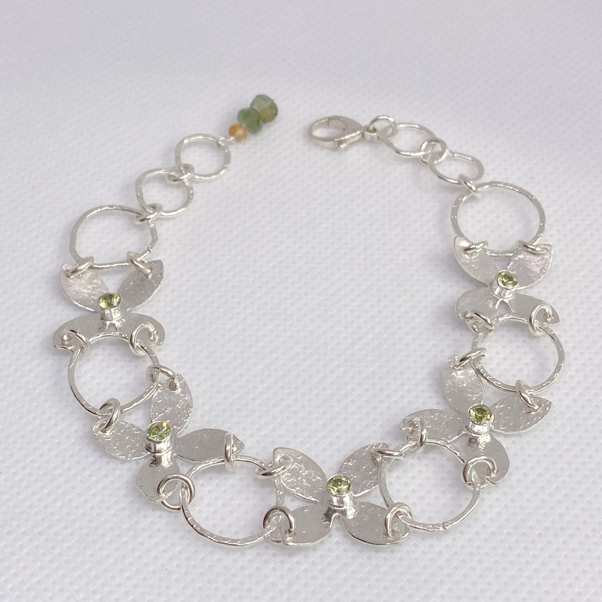 Sterling Silver Flower Petals Statement Bracelet featuring Peridots - Aprilierre