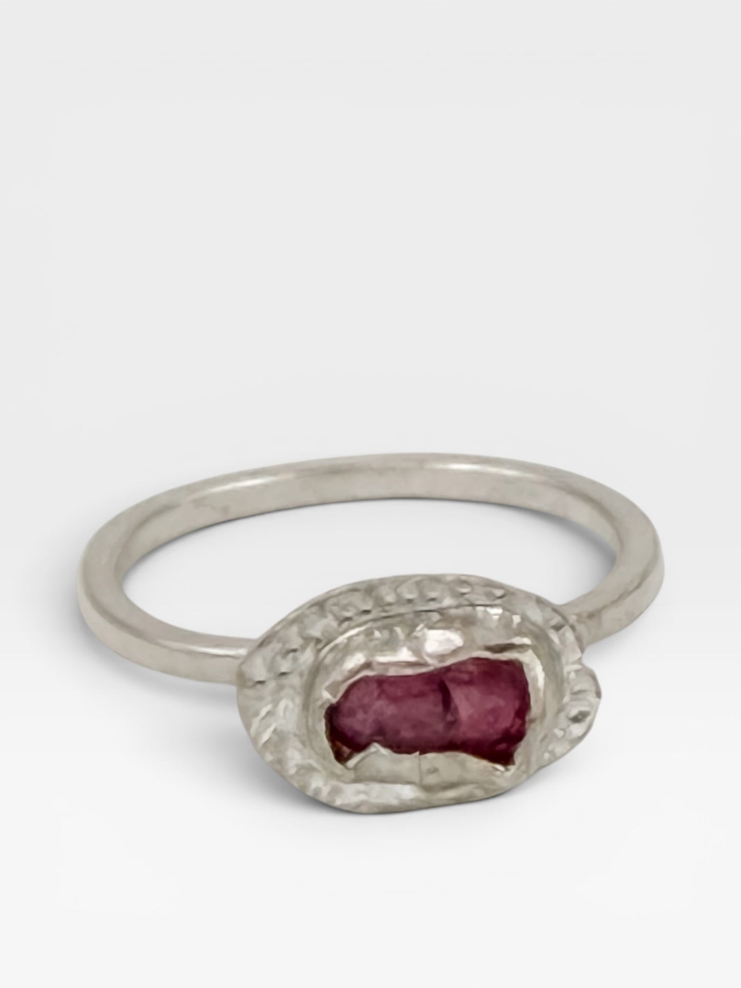 Sterling silver pink popsicle-shaped ring with a tourmaline gemstone, designed by Aprilierre, displayed on a white background.