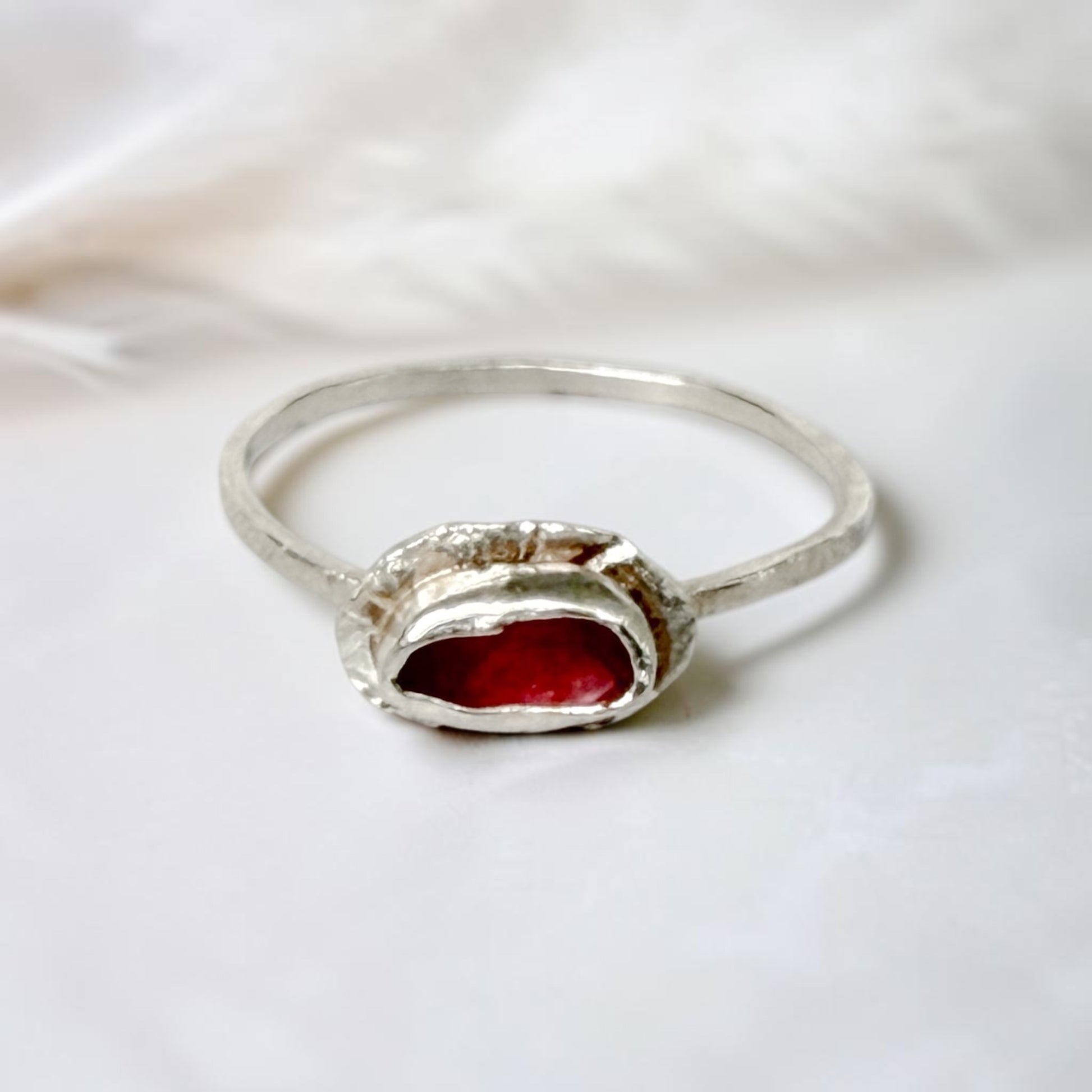 Sterling silver tourmaline ring with pink popsicle design by Aprilierre, featuring a vibrant pink gemstone and intricate band details.