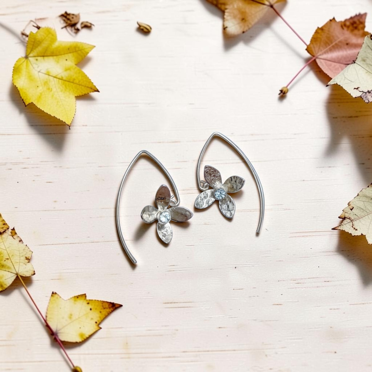 Eloquent Petals – Sterling Silver Earrings with Sky Blue Topaz