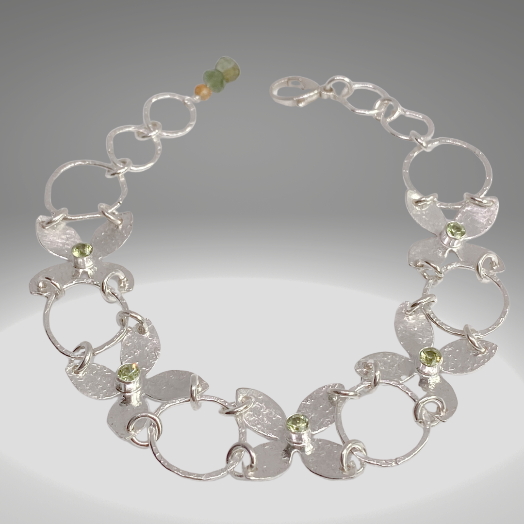 Sterling Silver Flower Petals Statement Bracelet featuring Peridots - Aprilierre